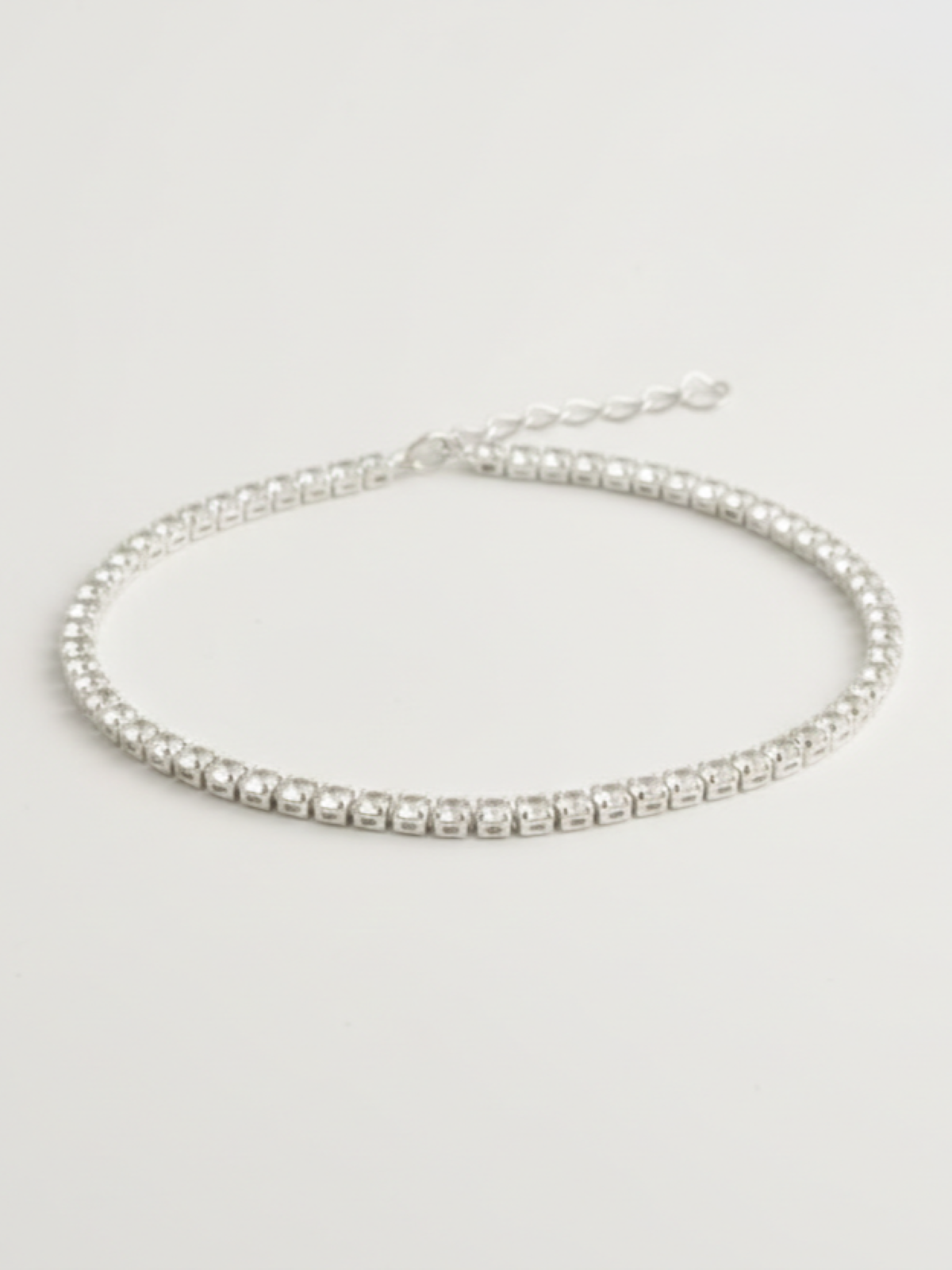 Gneis tennisarmbånd i rustfritt stål med klare steiner, justerbart 15+5 cm