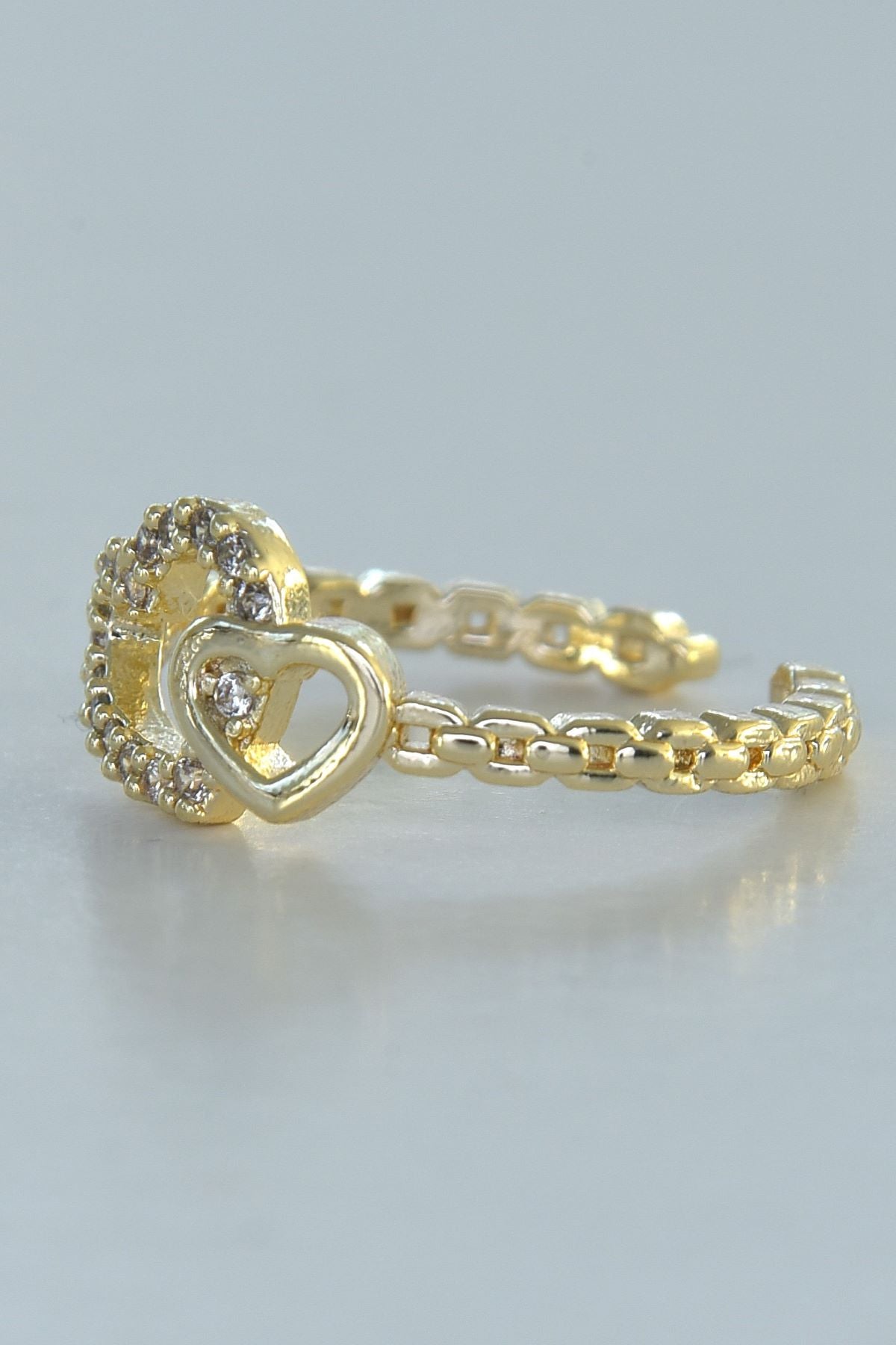 Tvillinghjerte-ring i gullfarge, laget av stål